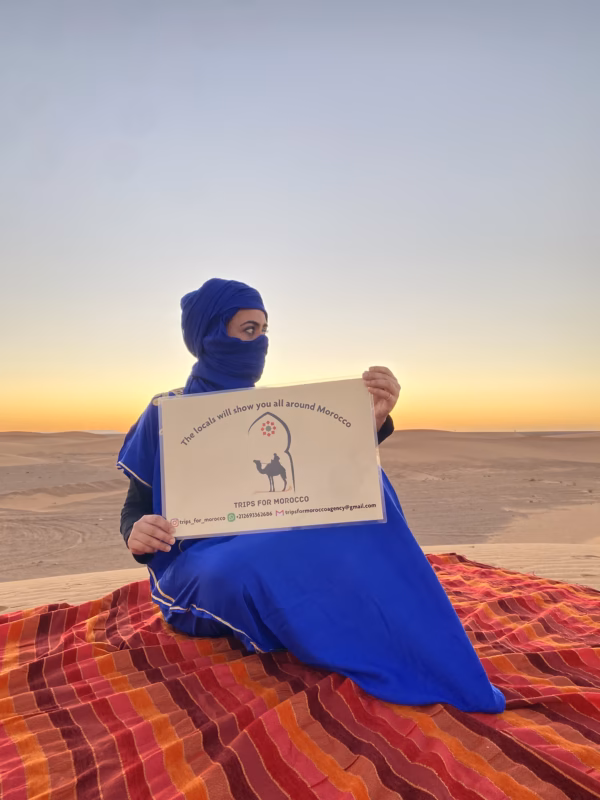 a women holding the banner of tripsformorocco